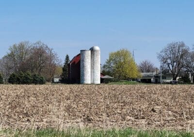 Barn with 2 silos near cornfield