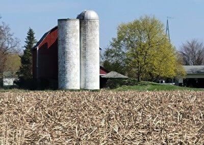 Barn with 2 silos near cornfield